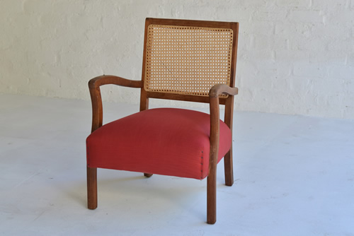 050 Lounge chairs - Cane and wooden chair with burnt red seat